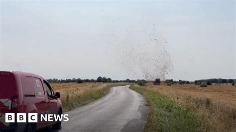 hotdevil|Dust devils filmed lifting tents after hot weather in the East .